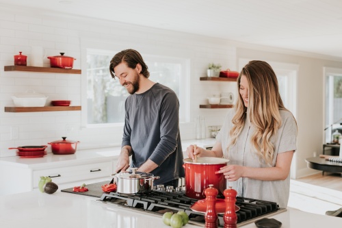 Relationship: Couple cooking in kitchen
